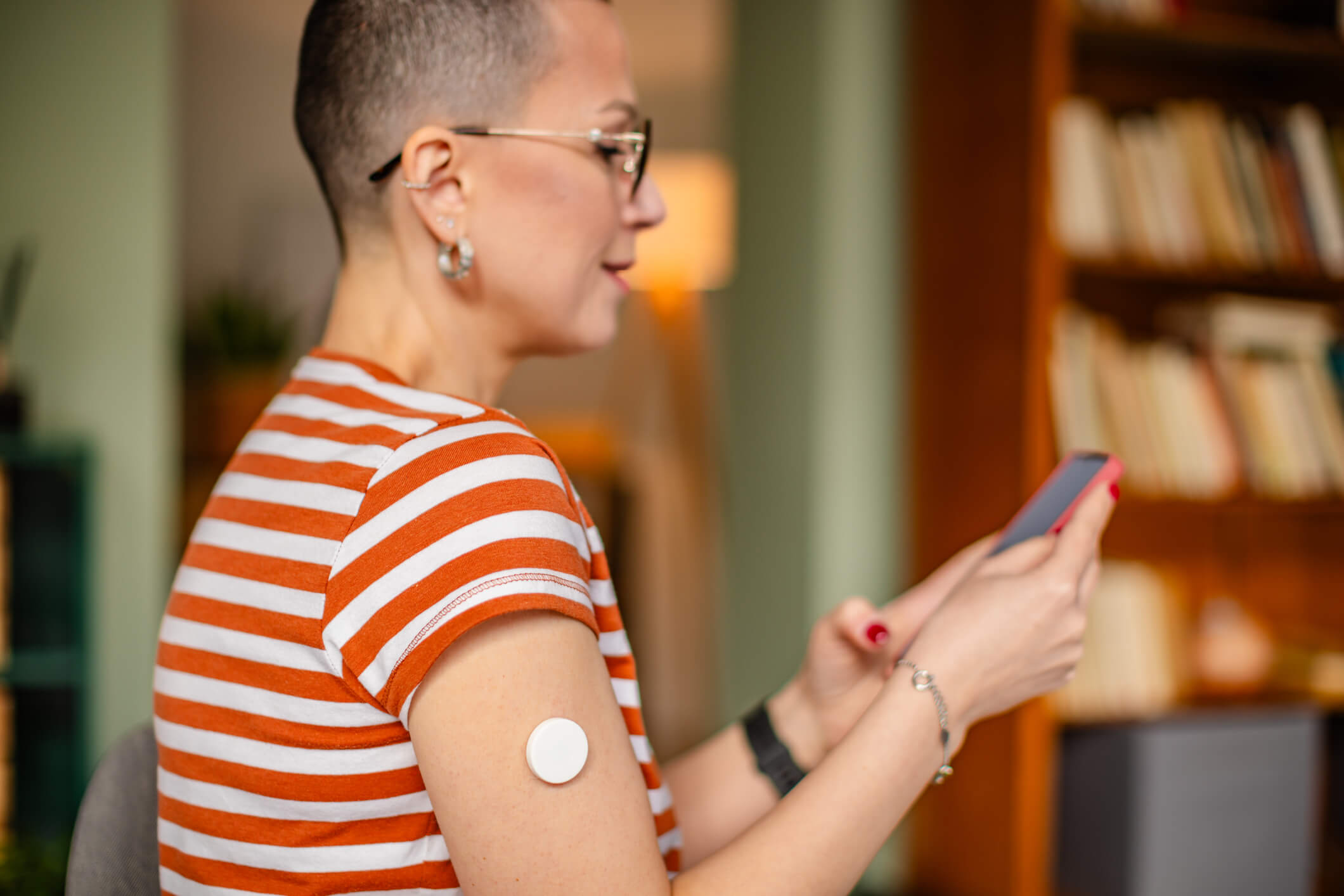woman with diabetes interacting with health data on technology
